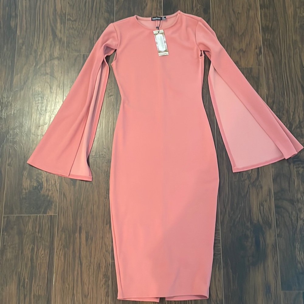 Rose fitted dress with elegant long “cape” sleeves.